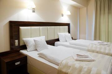 Фото номера Стандартный двухместный номер с 2 отдельными кроватями Отель Hotel Binkowski г. Кельце 7