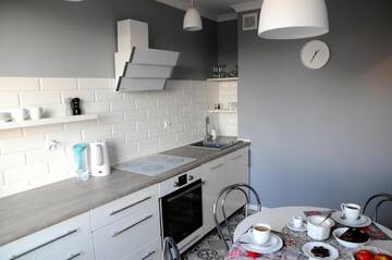 Фото номера Апартаменты с 2 спальнями Апартаменты Apartament Kiza г. Кельце 22